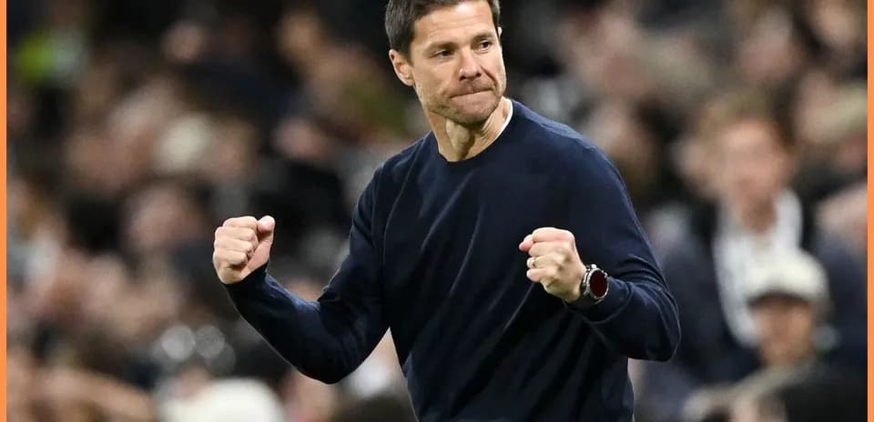 Coach celebrating with clenched fists during match