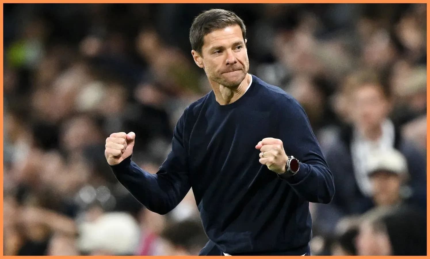 Coach celebrating with clenched fists during match