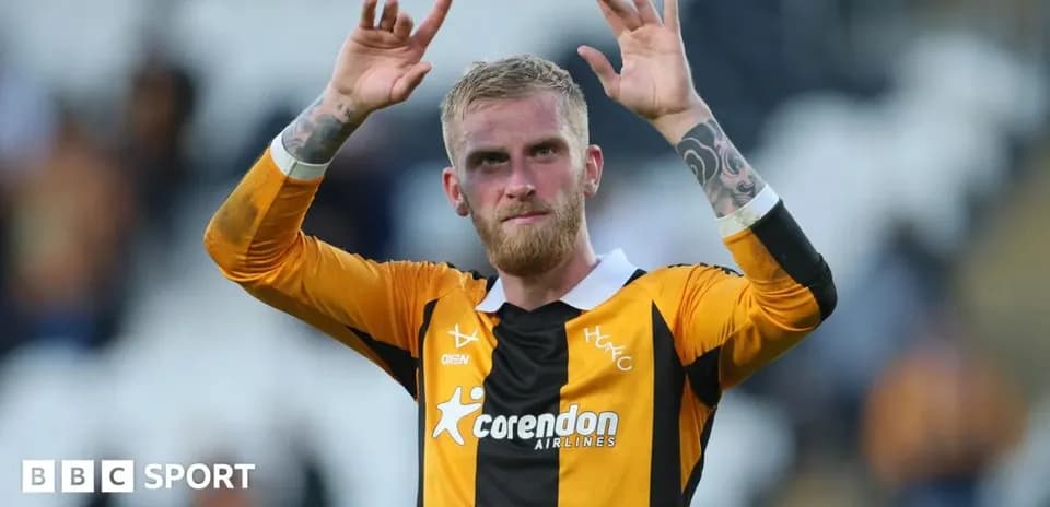 Player acknowledging fans after match in jersey