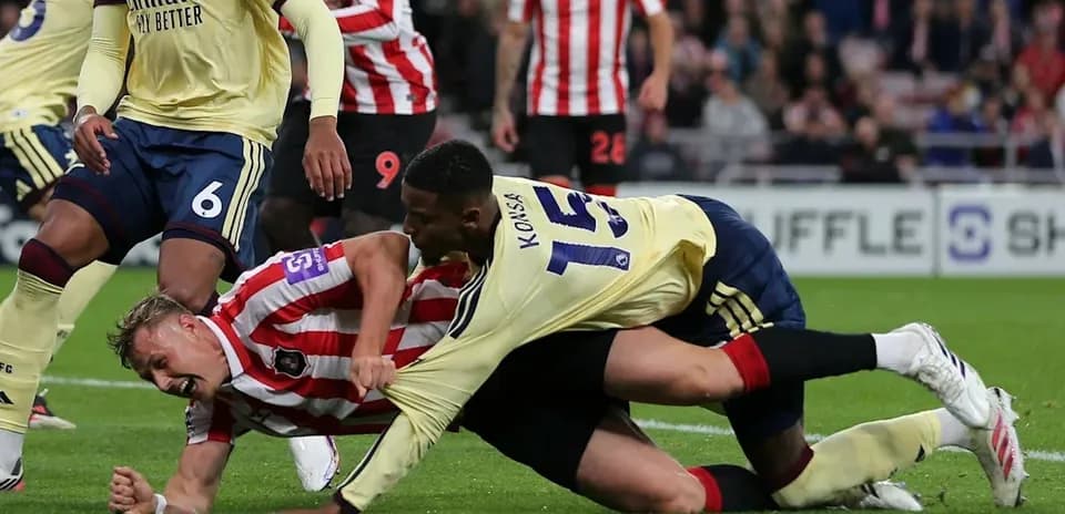 Players competing on the ground during a match