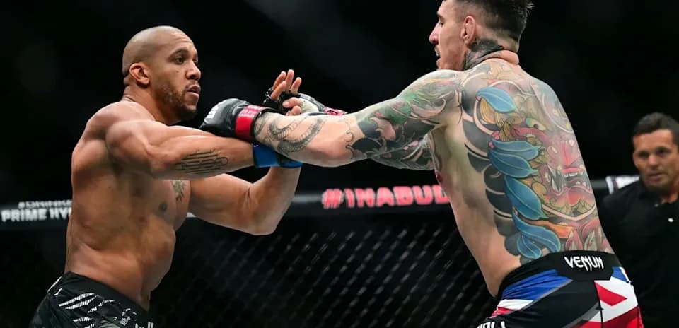 Two fighters exchanging punches in MMA match