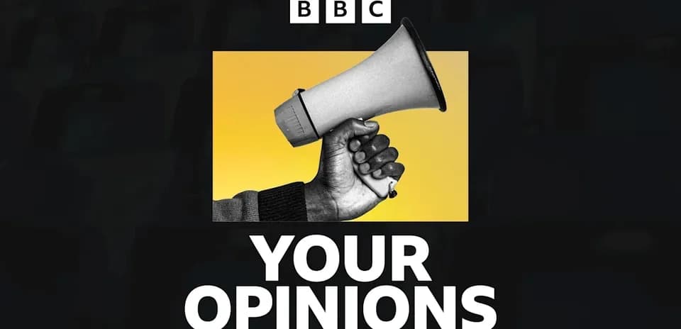 Hand holding megaphone against yellow background