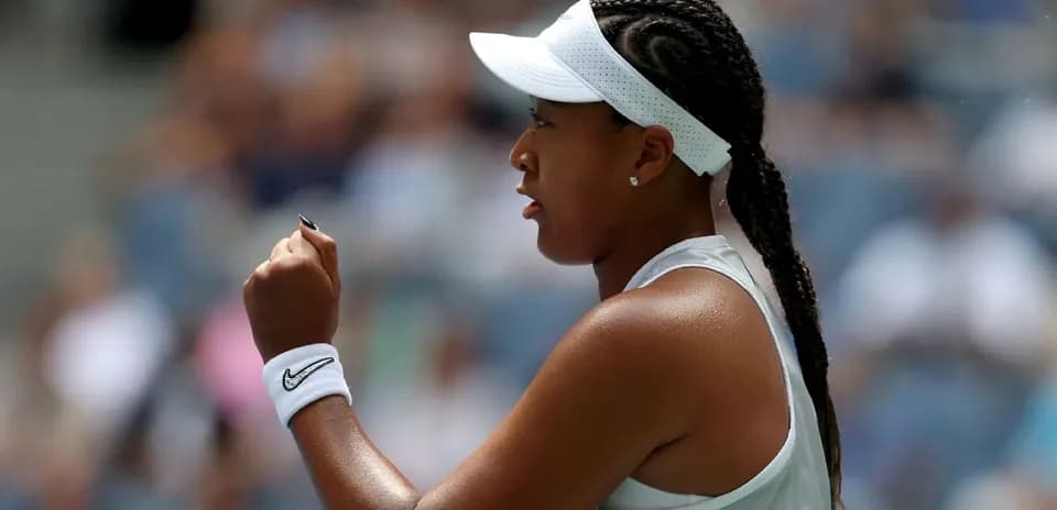 Tennis player celebrating a point during match