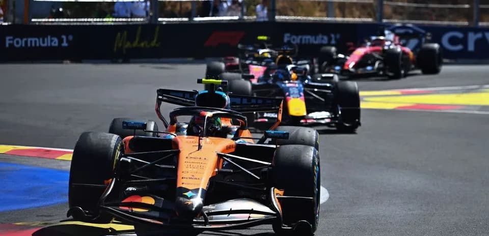 Formula 1 cars racing on a track in Madrid