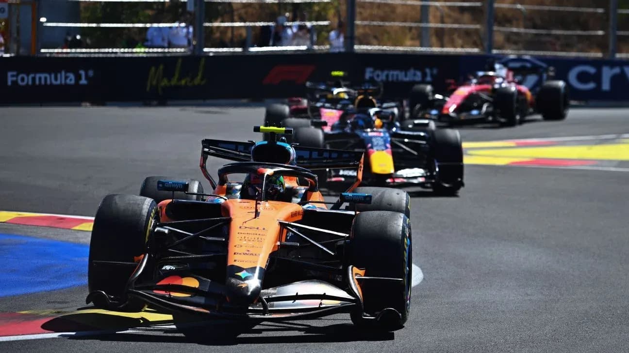 Formula 1 cars racing on a track in Madrid