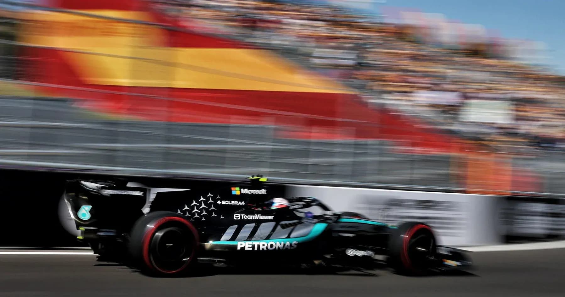Formula 1 car racing past in blurred motion