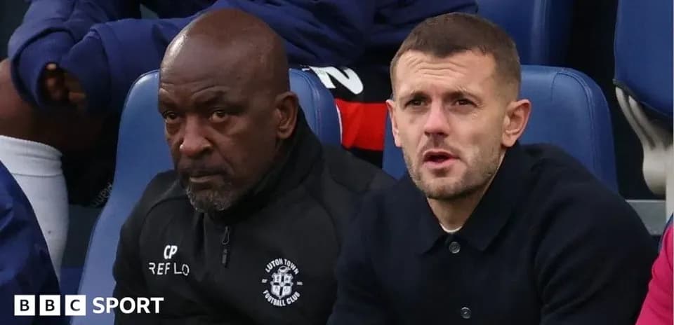 Two men sitting on bench during a match