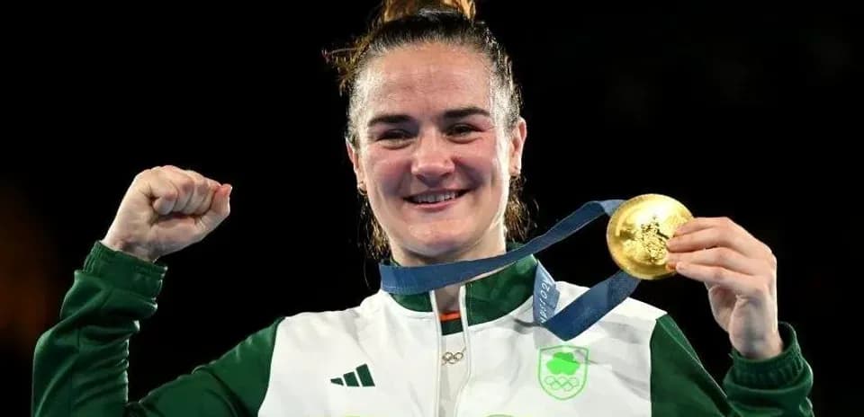 Athlete celebrating with gold medal at Olympics