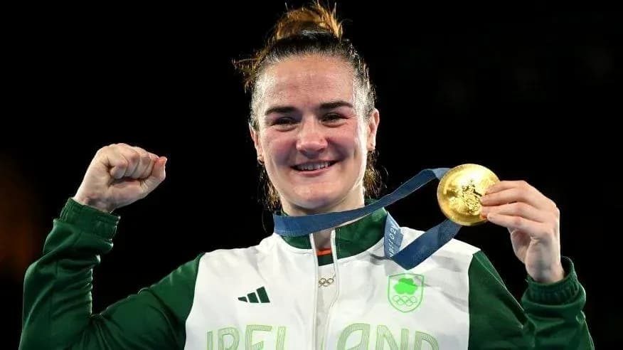 Athlete celebrating with gold medal at Olympics
