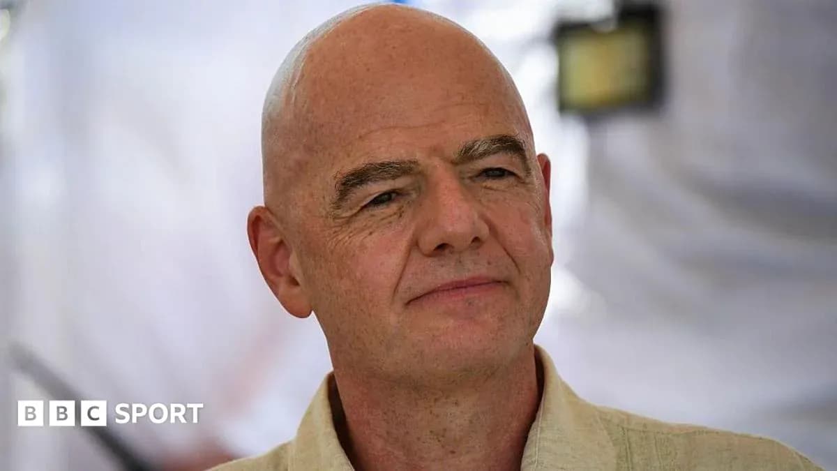 Man with bald head speaking at event