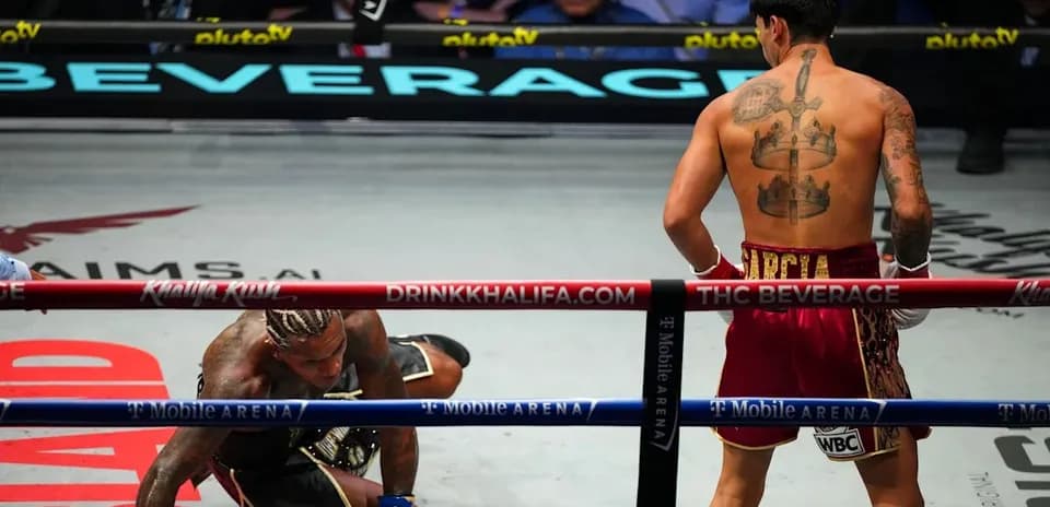 Boxer on the canvas during a championship match