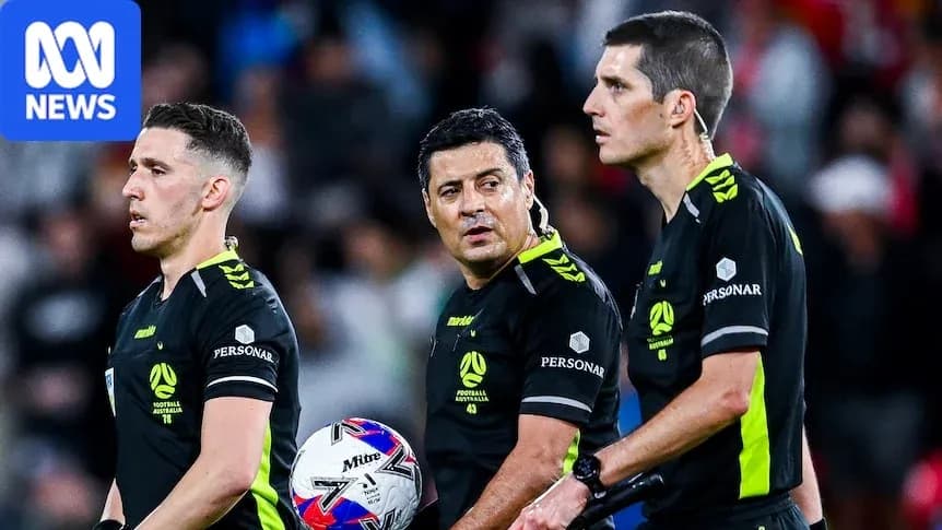 Three referees discussing during a football match