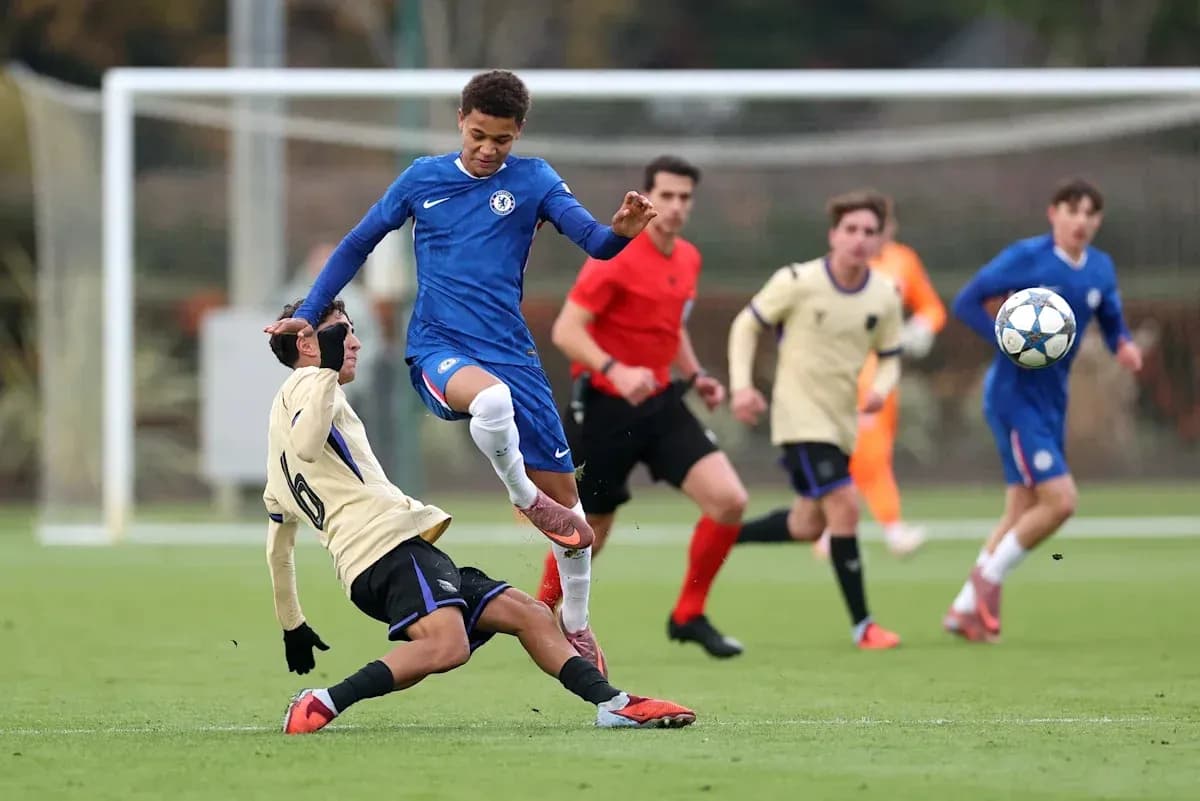 Player in blue jumping over opponent on the field