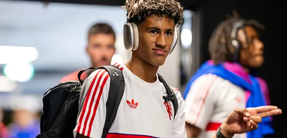 Player wearing headphones walking in tunnel