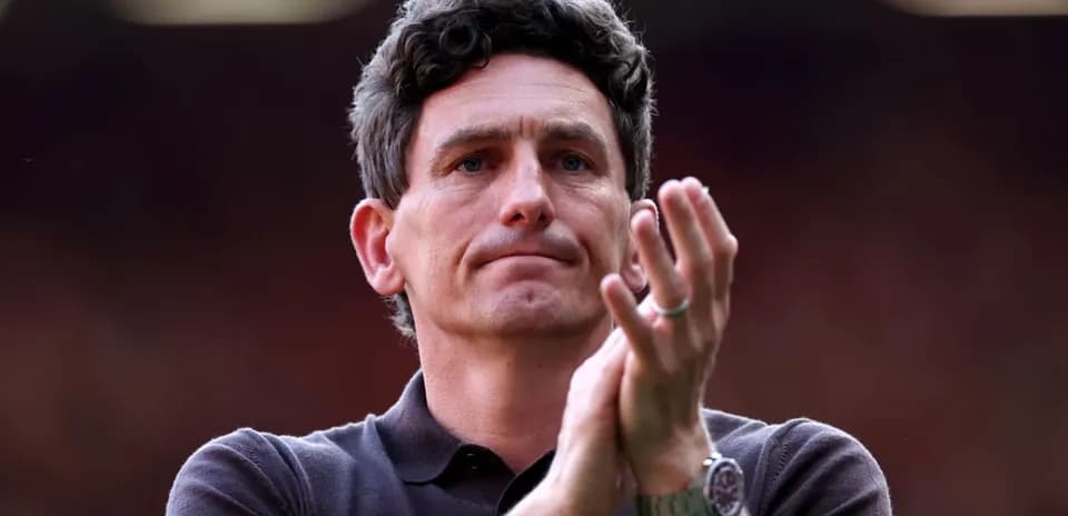 Man clapping during a sports event