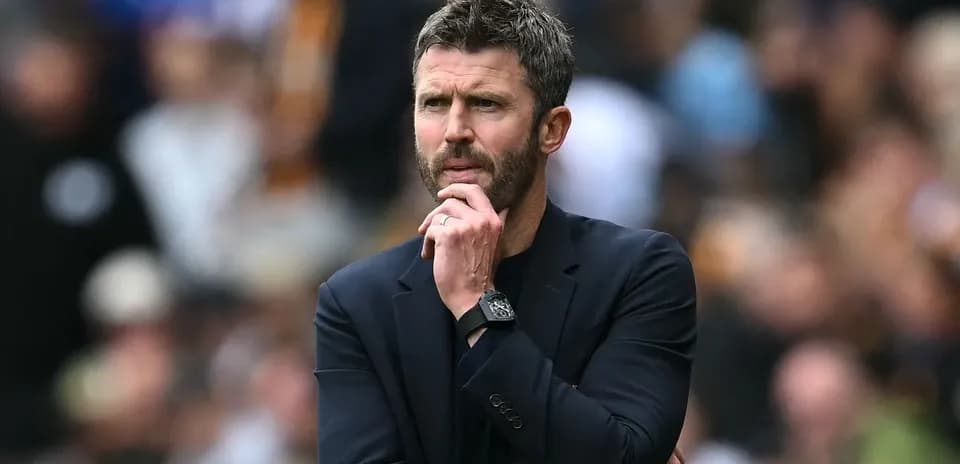 Coach observing the match from the sidelines