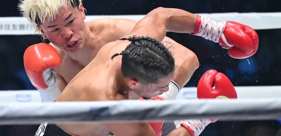 Boxers exchanging punches during a match