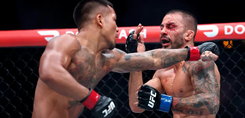 Fighter delivering a punch in the octagon