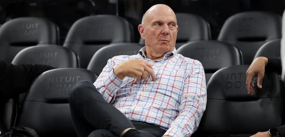 Person sitting in seats at basketball arena