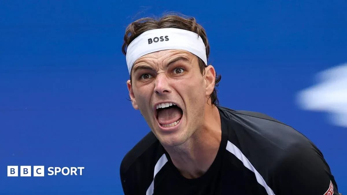 Tennis player celebrating during match with intense expression