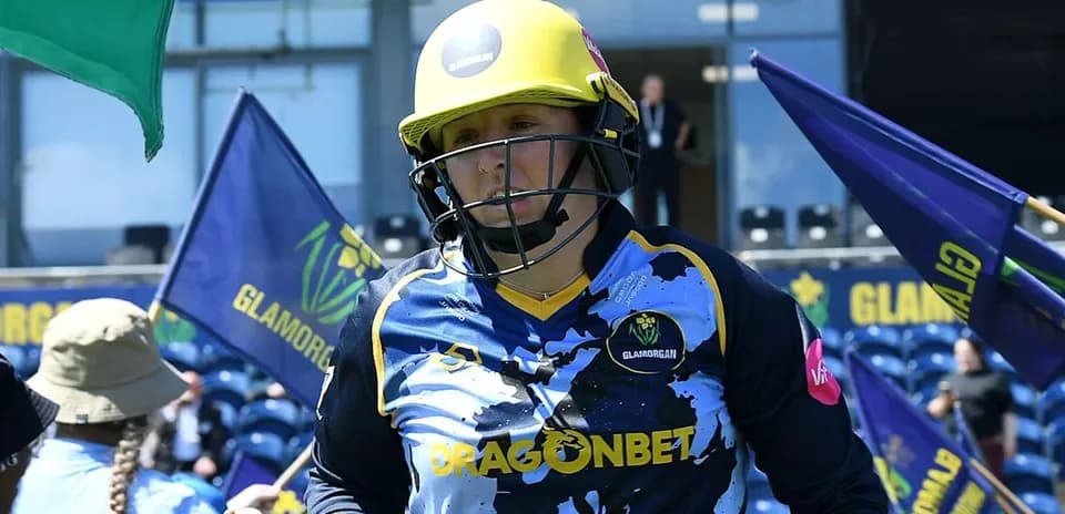 Cricketer from Glamorgan walking onto the field