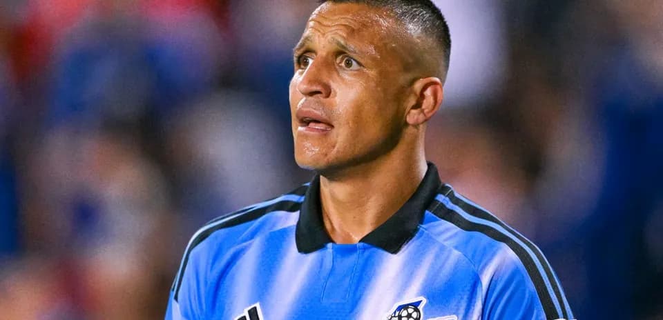 Goalkeeper in blue jersey during match action