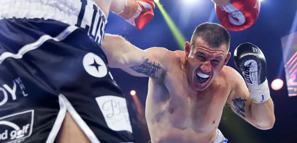 Boxer throwing a punch during a match