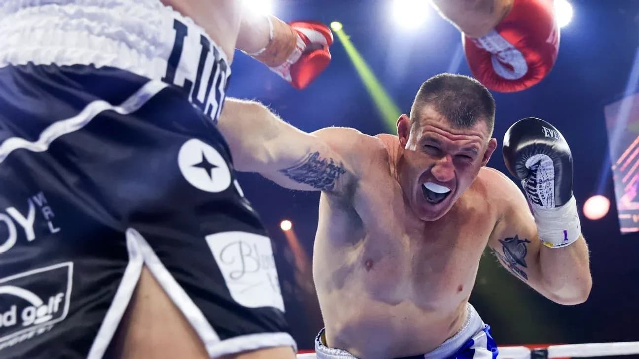 Boxer throwing a punch during a match