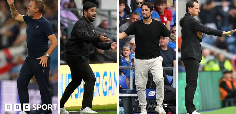 Four football managers coaching on the sidelines