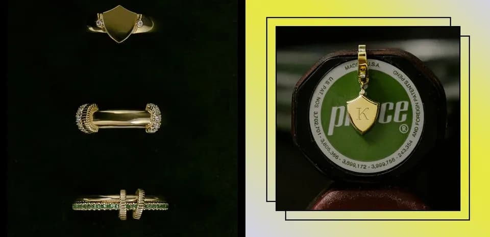 Gold rings and a pendant displayed on a surface