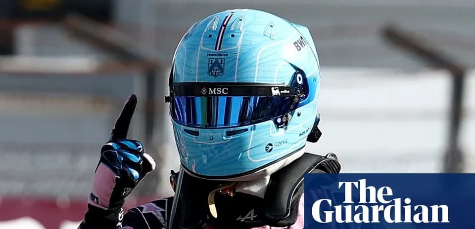 Racing driver celebrating with a raised finger