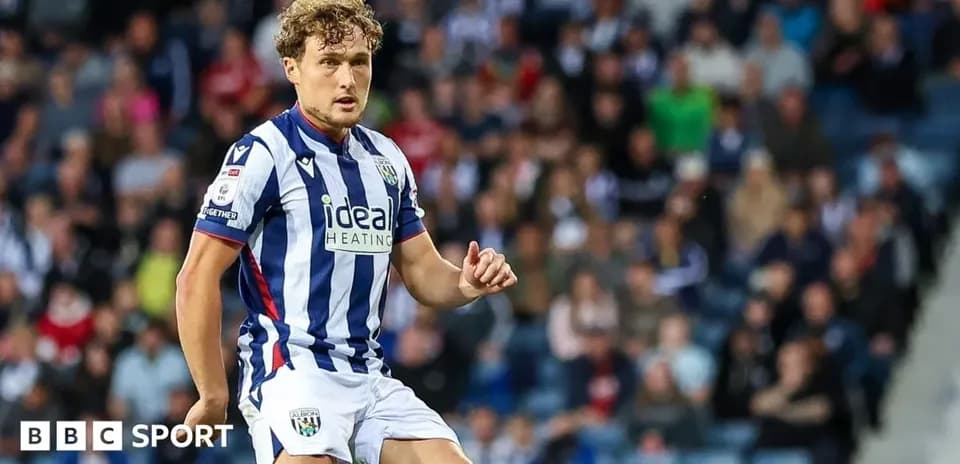 Player in striped jersey during a football match