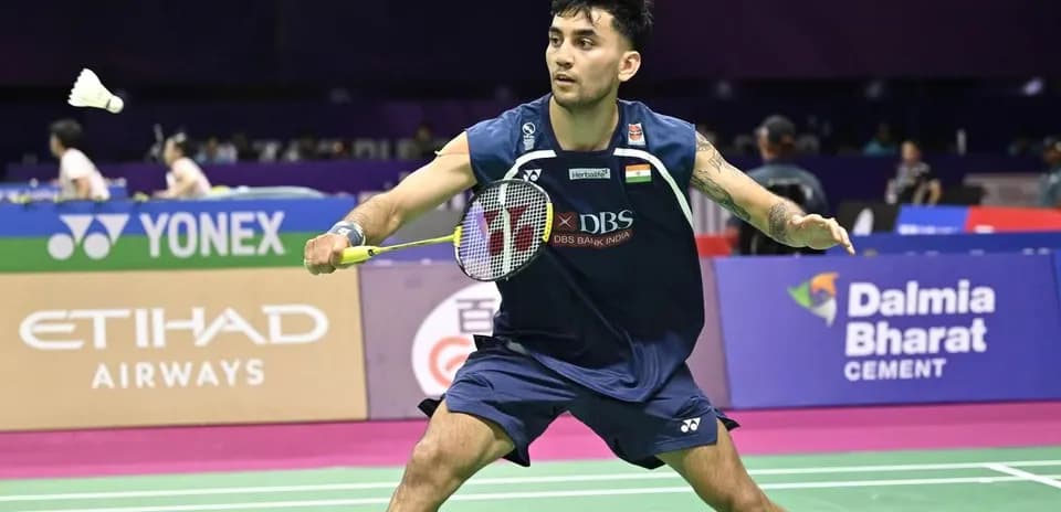 Player hitting shuttlecock during badminton match