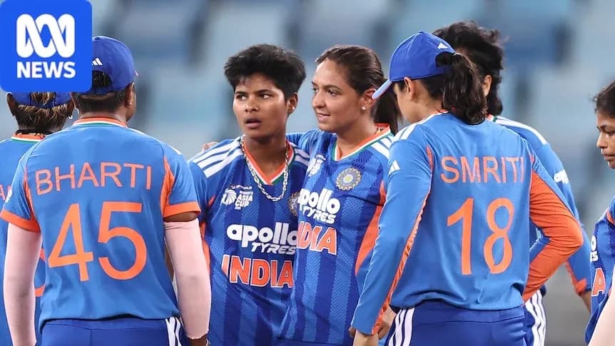 Indian women's cricket team discussing strategy on field