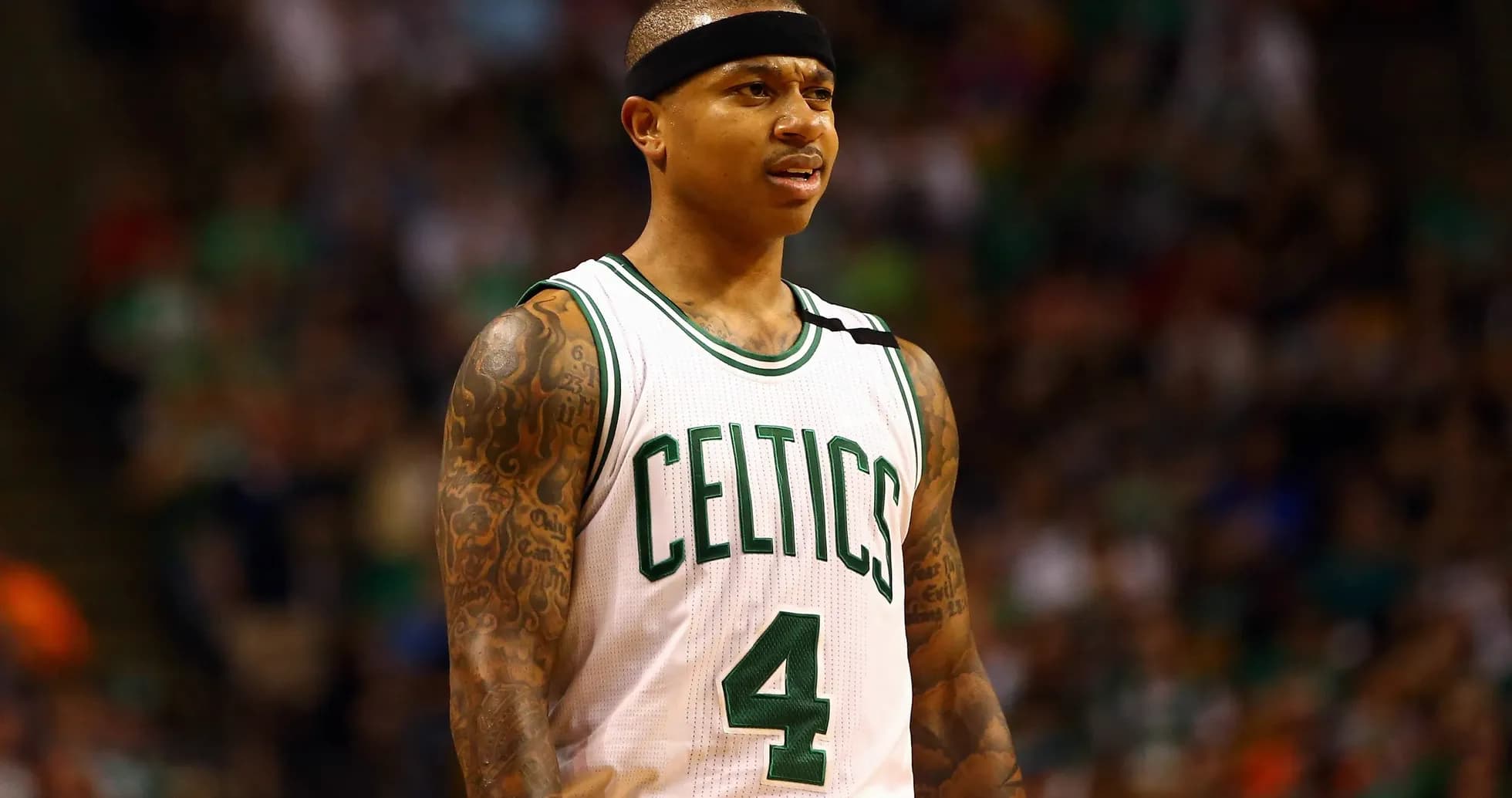 Basketball player in Celtics jersey on court