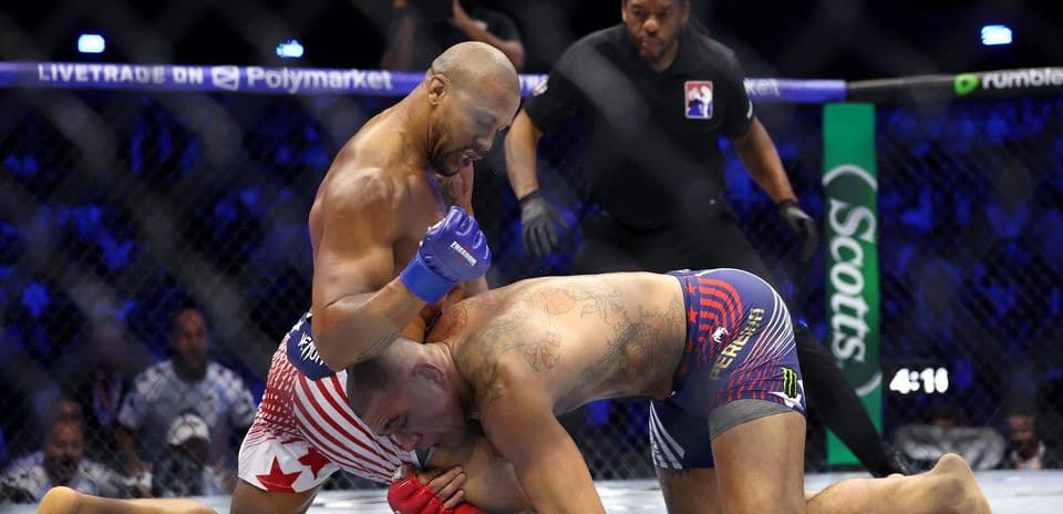 Fighters grappling in an MMA match inside the octagon