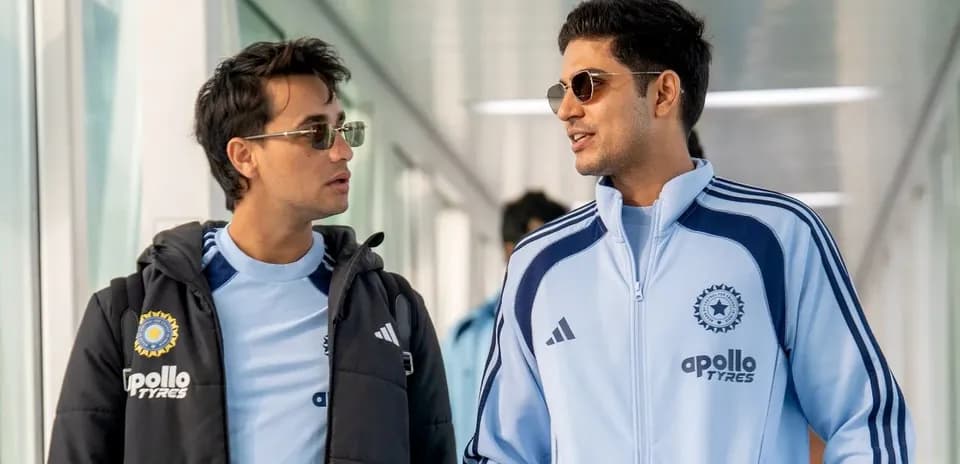 Two players in training jackets walking together