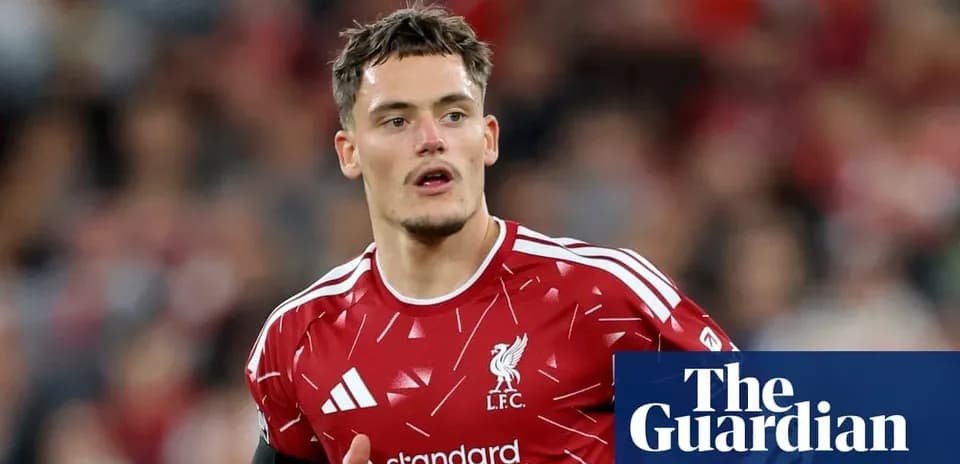Player in red Liverpool jersey on the field