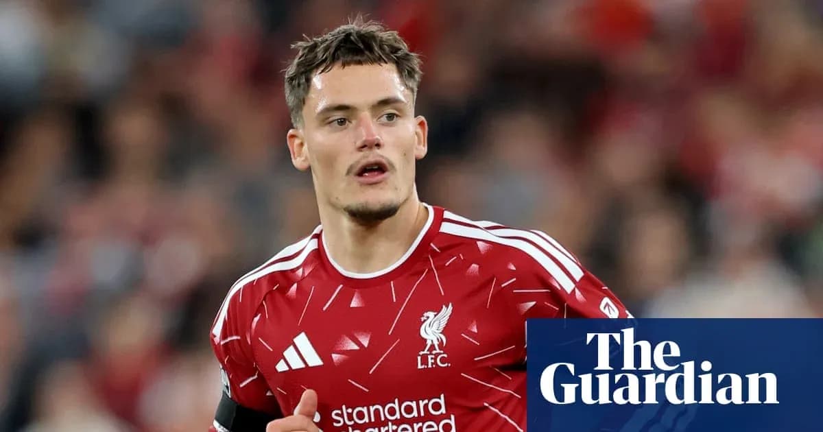 Player in red Liverpool jersey on the field