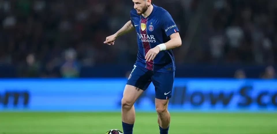 Player dribbling ball during match at stadium