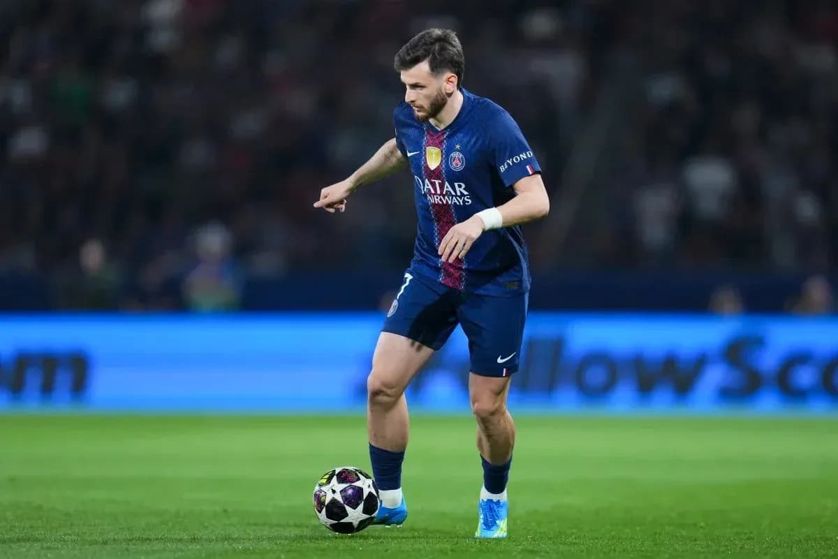 Player dribbling ball during match at stadium