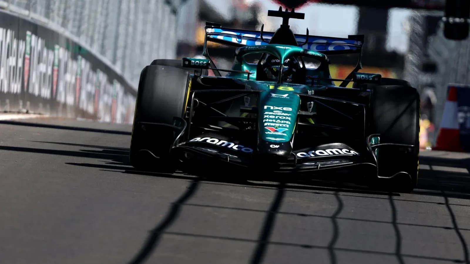 Aston Martin Formula 1 car racing on track