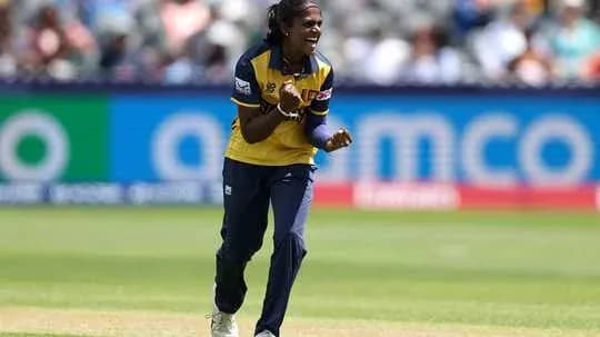 Player celebrating a wicket during cricket match