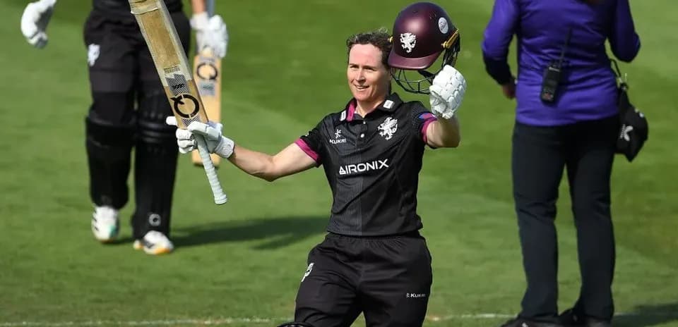 Batsman celebrating with bat after scoring runs