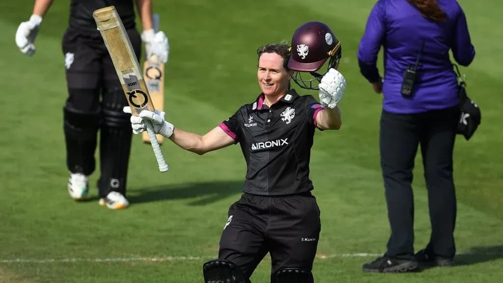 Batsman celebrating with bat after scoring runs Batsman celebrating with bat after scoring runs
