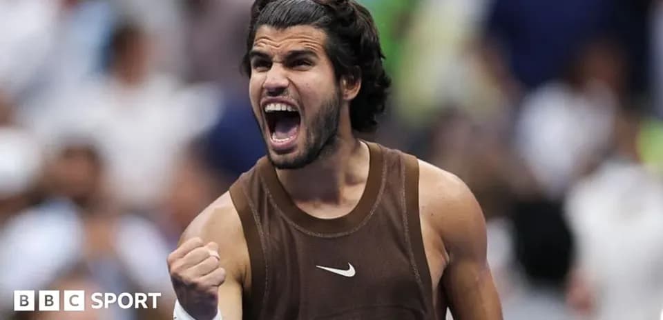 Tennis player celebrating victory with a fist pump
