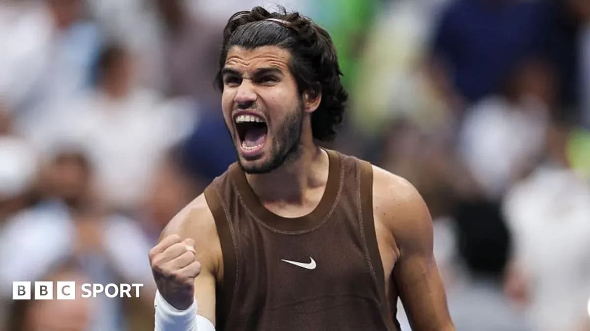 Tennis player celebrating victory with a fist pump