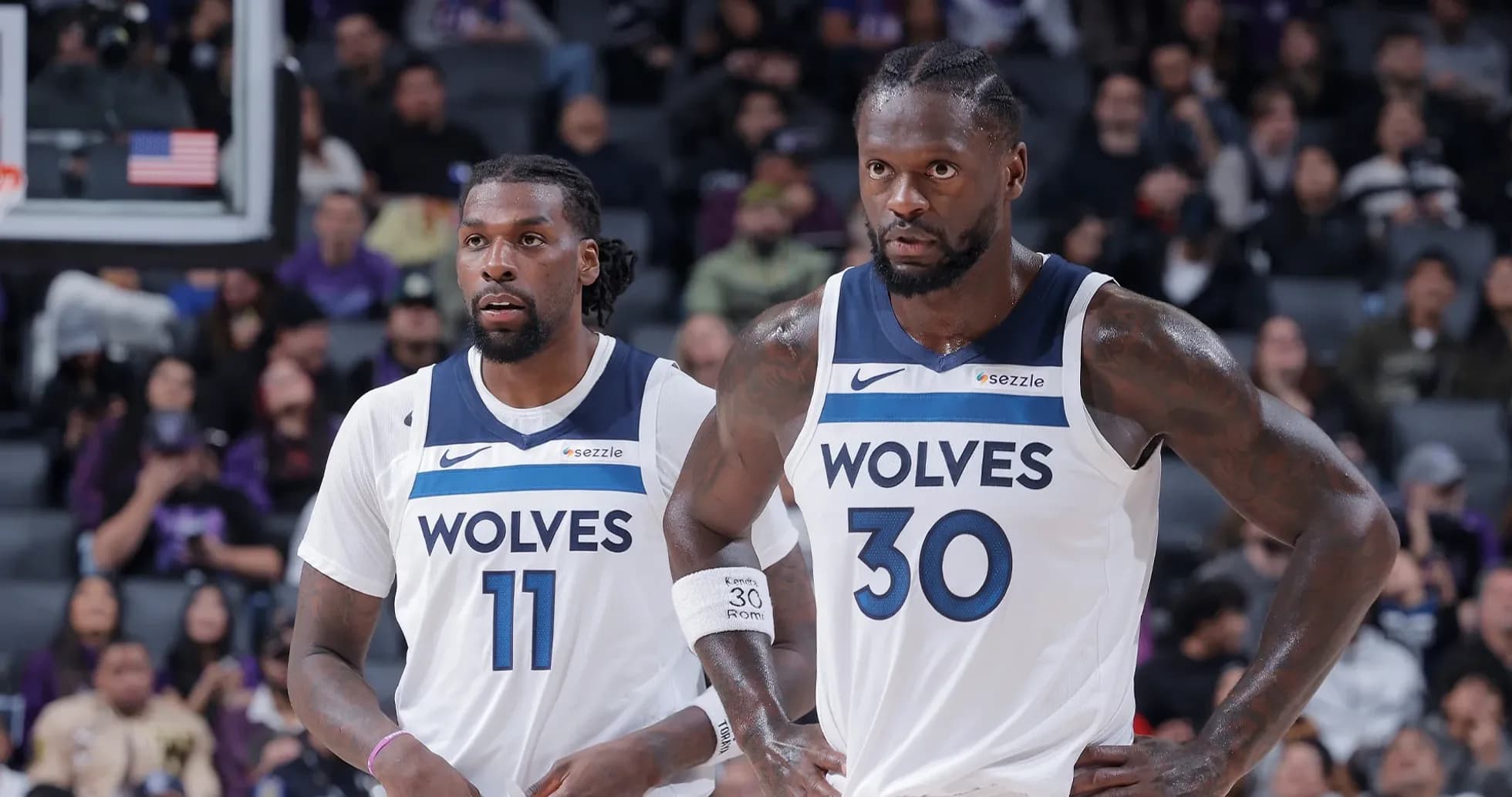 Two Timberwolves players on the court during game