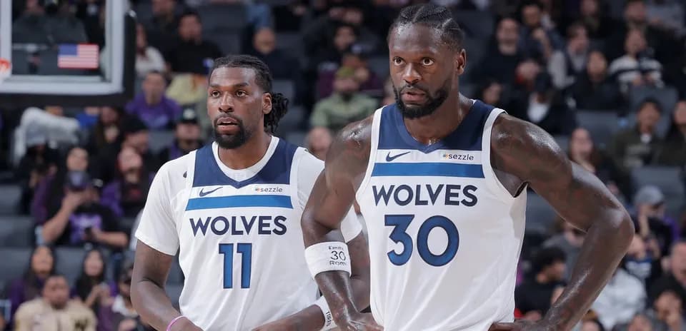 Two Timberwolves players on the court during game