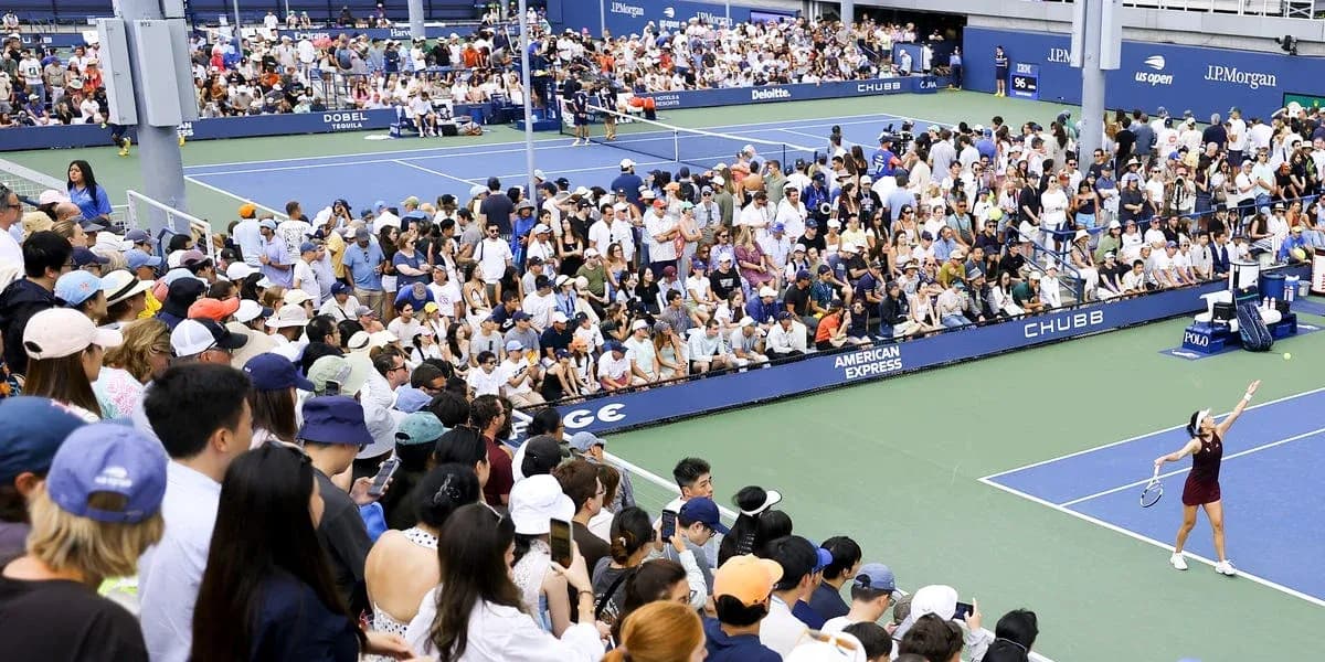 Crowd watching tennis match at stadium